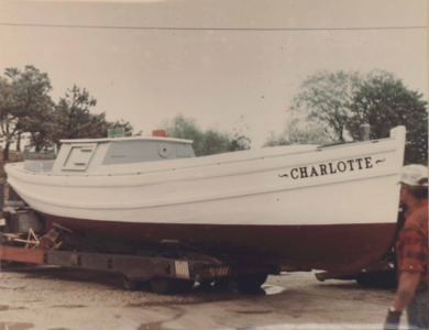 Color photograph of the trapboat Charlotte after restoration