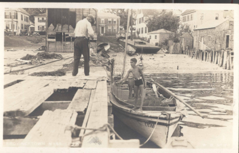 Boy in a boat  at dock
