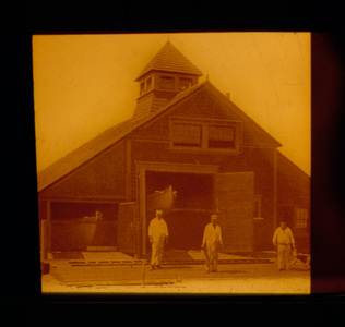 Three Men in White Standing on Doors of Station